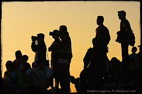 Photographers and spectators waiting for the balloons to fly.