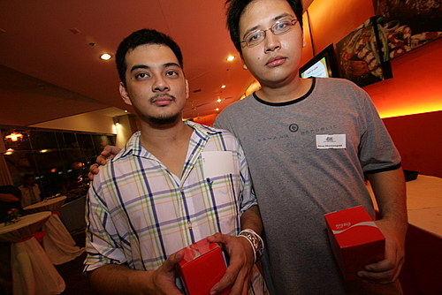 Jayvee and Rico look gloomy with their free coke glasses.