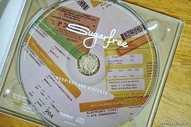 The album CD designed with airline boarding pass images.